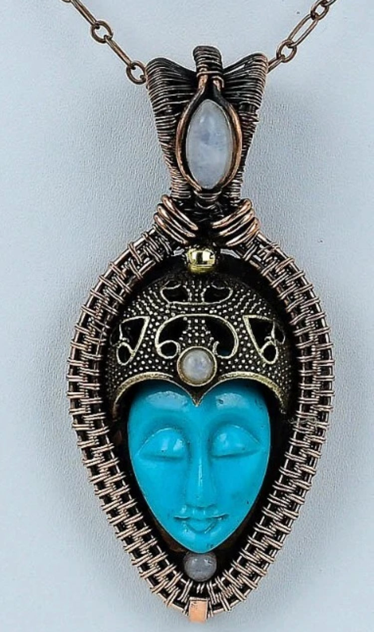 Blue Carved Bone Buddha Face with Moonstone Pendant