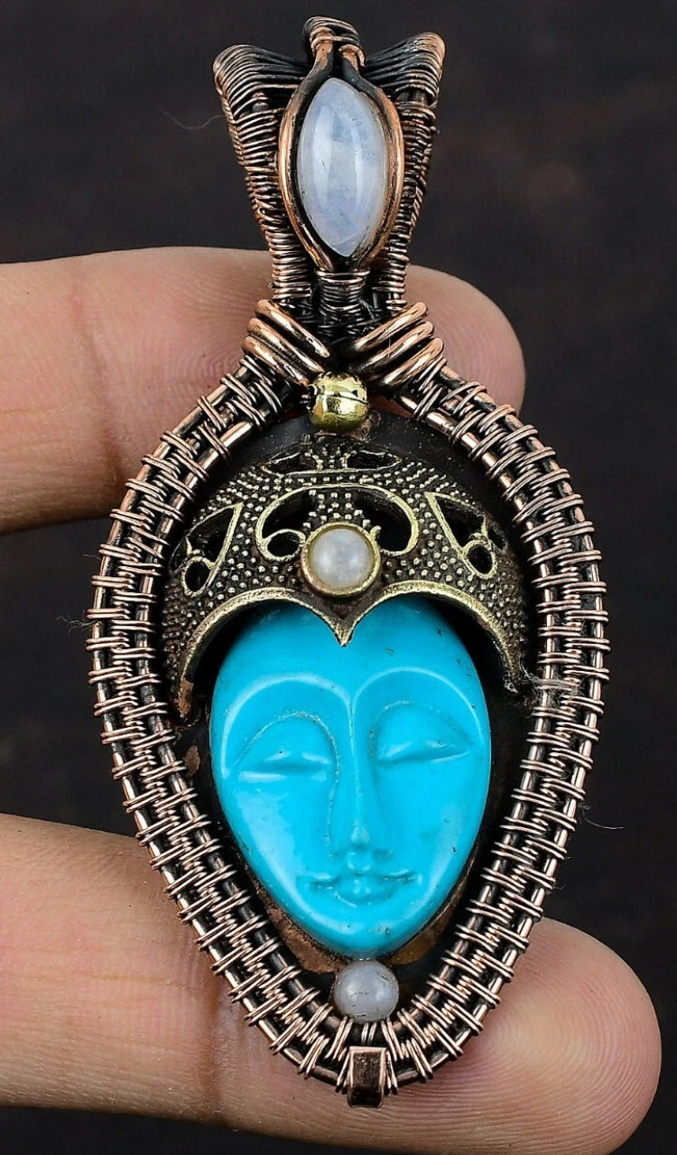 Blue Carved Bone Buddha Face with Moonstone Pendant